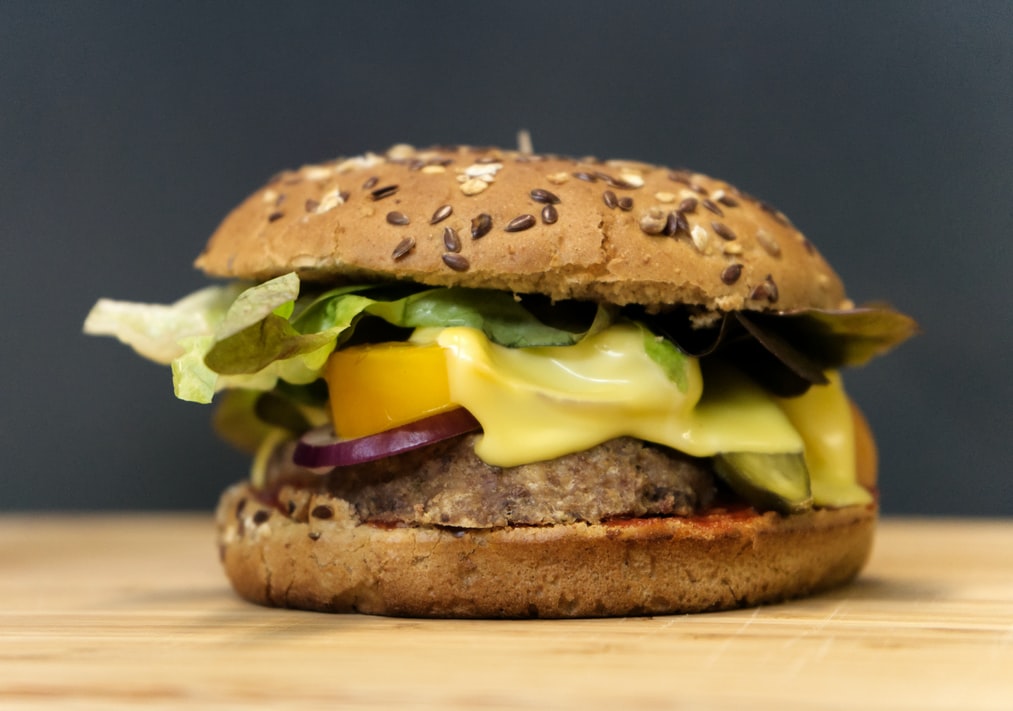 Vegetarian-burger-with-cheese-tomato-onion-and-salad